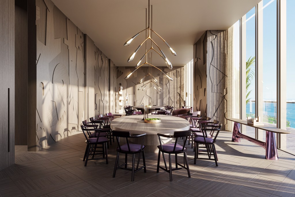 Interior of Jean-Georges Miami Tropic Residences with round table and chairs, kitchen appliances styled by iconic chef Jean-Georges