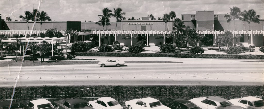 Vintage black and white photo of Bal Harbor's 60th anniversary celebrations with floral installations and luxury brand experiences at Bal Harbor Shops