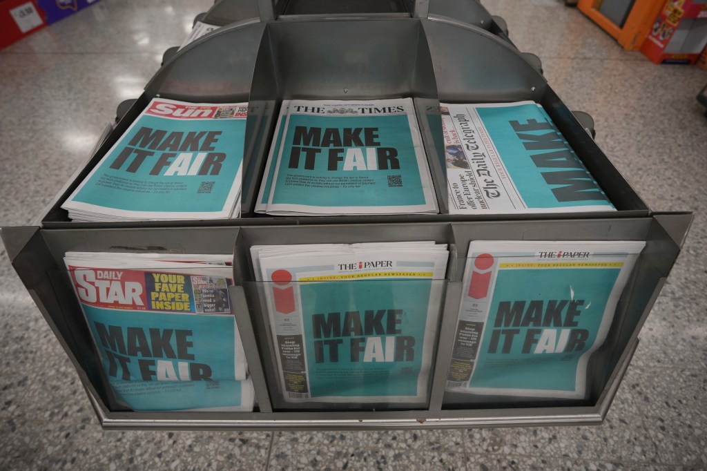 British newspapers containing an ad protesting the planned UK changes to artificial intelligence laws.